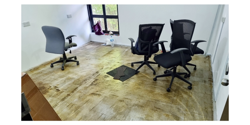 a room with messy flooring 